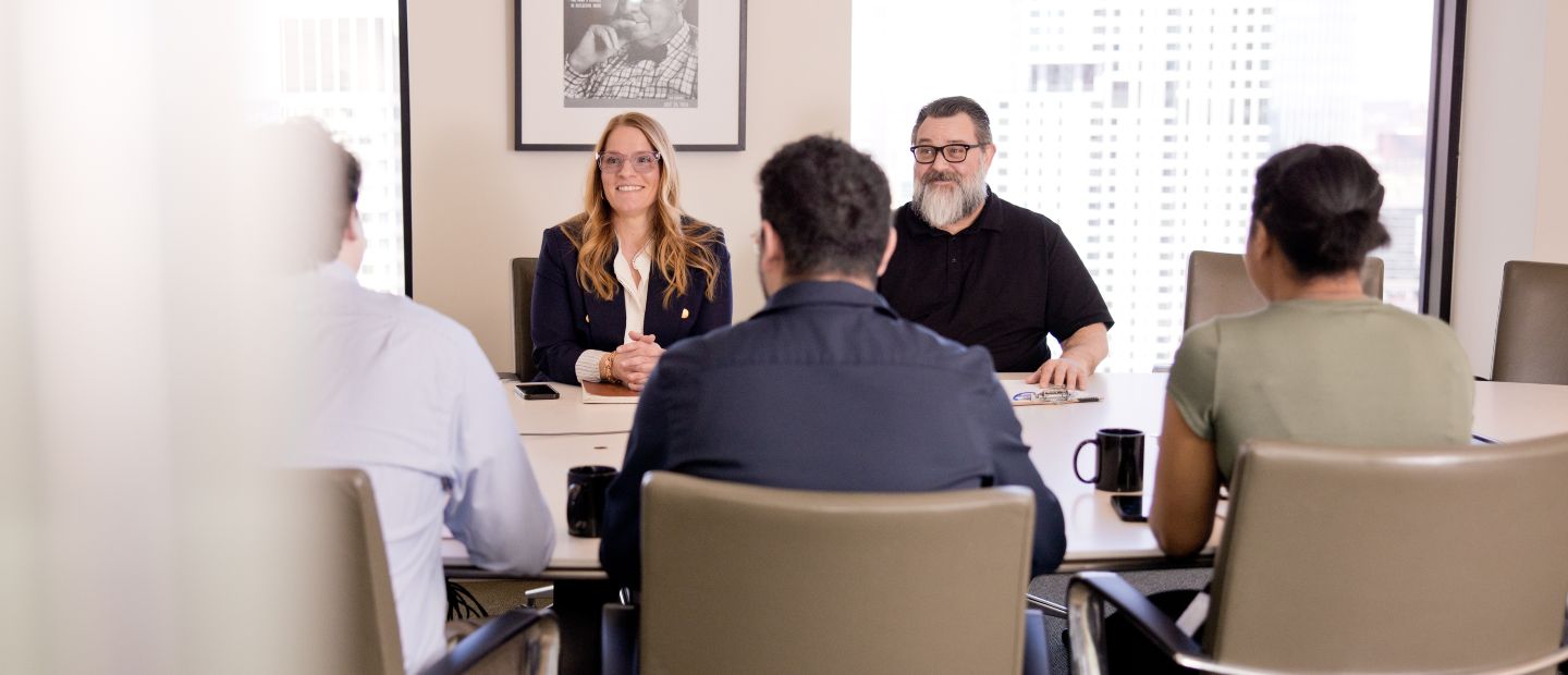 business professionals sitting around a table